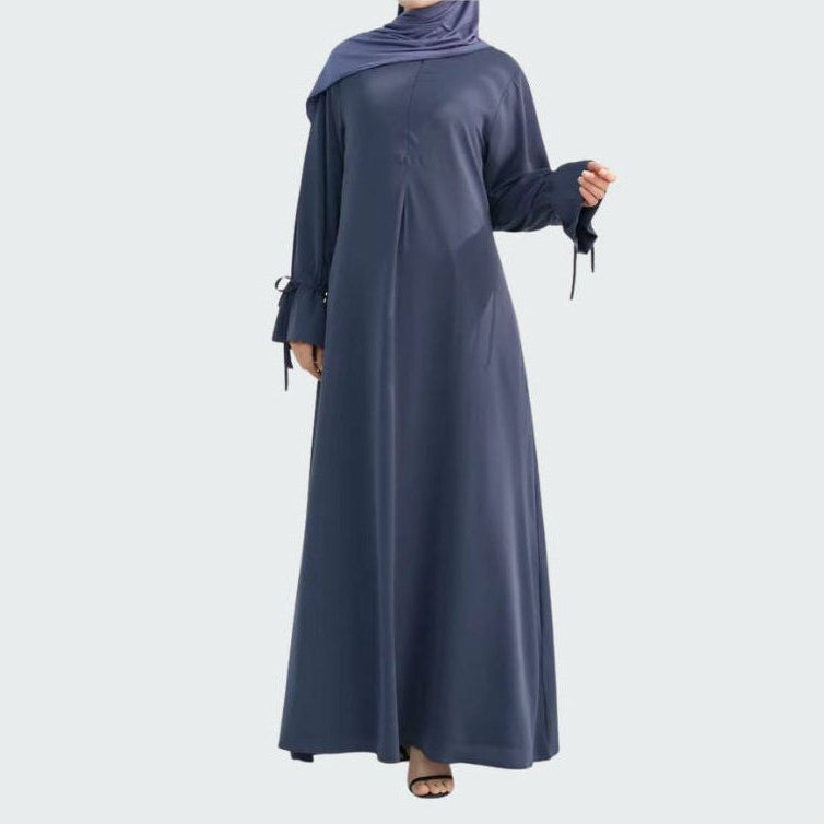 a model wearing a navy nursing friendly abaya