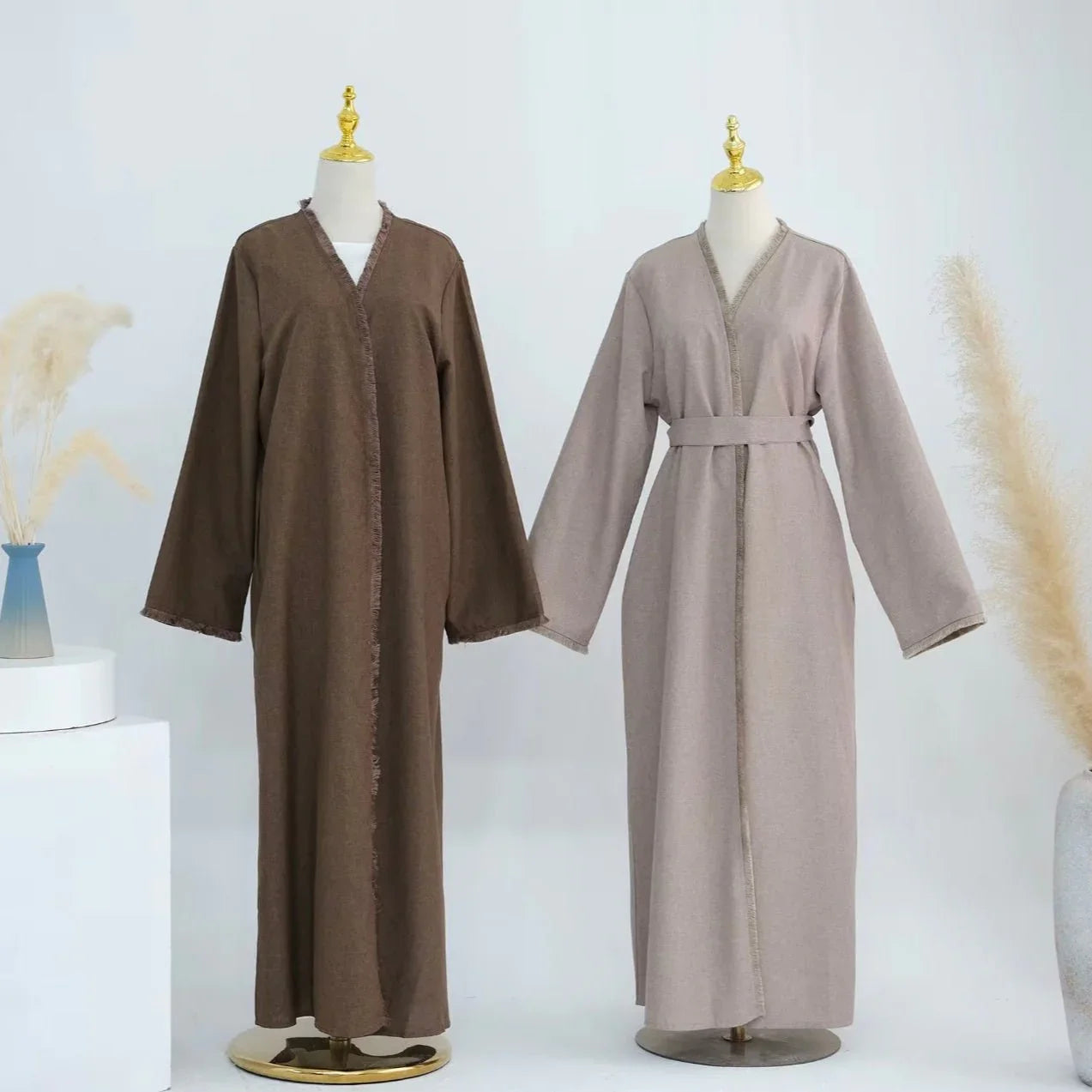 linen tassel abayas in the colours brown, beige and black with matching belts