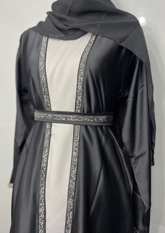 Al-Sayla 4-Piece Satin Abaya Set displayed on a mannequin, featuring an elegant ensemble with matching inner dress, belt, and scarf for a touch of modest luxury.